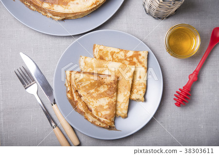 Traditional Russian pancakes with honey. Traditional Russian pancakes with honey. 38303611