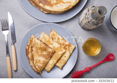 Traditional Russian pancakes with honey. Traditional Russian pancakes with honey. 38303612