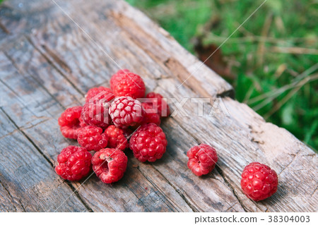 Raspberries on a wooden surface Raspberries on a wooden surface 38304003