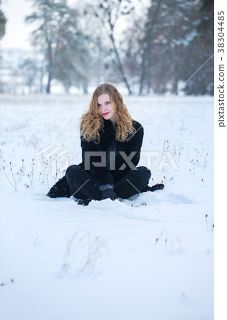 Happy woman playing with snow 38304485