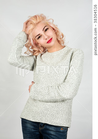 beautiful blond in a knitted sweater beautiful blond in a knitted sweater 38304516