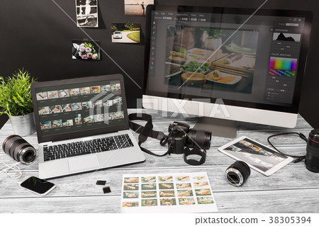Photographers computer with photo edit programs. 38305394