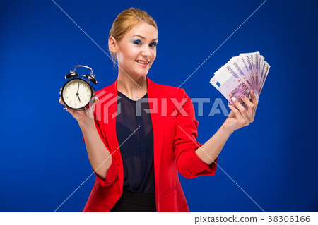 young girl with an alarm clock and money 38306166