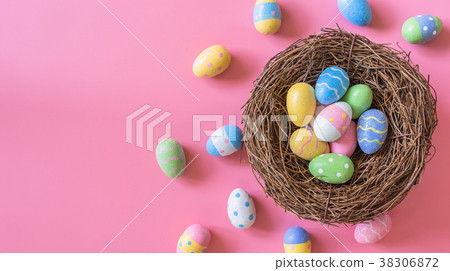 Colorful easter egg and nest on pink pastel color 38306872