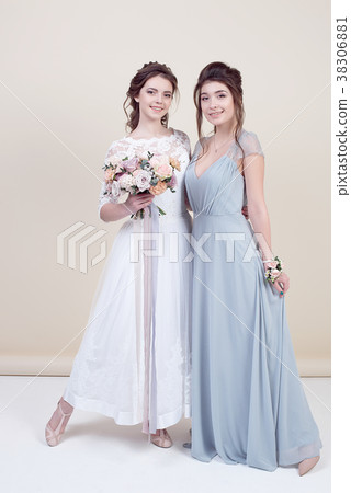 two adorable women wearing in long fashionable two adorable women wearing in long fashionable 38306881