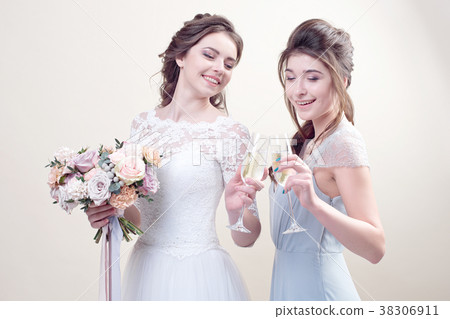 two adorable women wearing in long fashionable 38306911