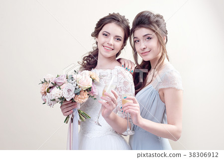 two adorable women wearing in long fashionable 38306912