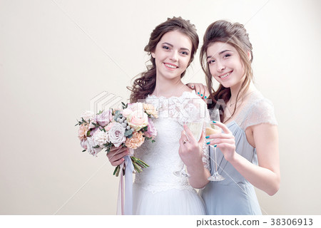 two adorable women wearing in long fashionable 38306913