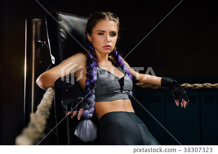 Sexy boxing girl stands leaned on ropes of Sexy boxing girl stands leaned on ropes of 38307323