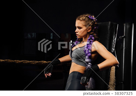 Sexy boxing girl stands leaned on ropes of Sexy boxing girl stands leaned on ropes of 38307325