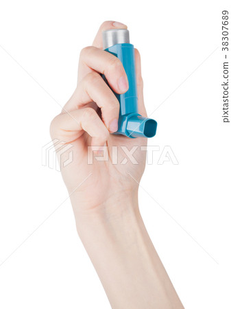 Hand holds blue asthma inhaler for relief asthma Hand holds blue asthma inhaler for relief asthma 38307689