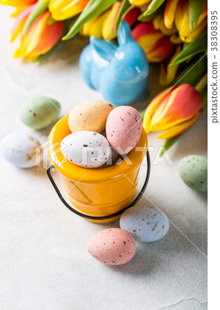 Easter composition with quail eggs and tulips Easter composition with quail eggs and tulips 38308395