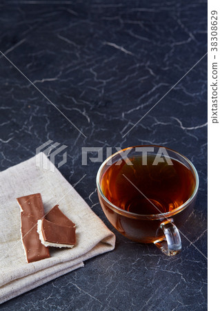 Vertical picture of a glass cup of black tea with Vertical picture of a glass cup of black tea with 38308629