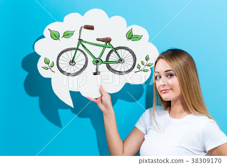 Eco Bicycle with woman holding a speech bubble Eco Bicycle with woman holding a speech bubble 38309170