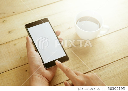 Hands holding smart phone 38309195