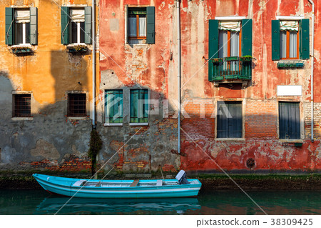 Old house and boat on canal in Venice, Italy. Old house and boat on canal in Venice, Italy. 38309425