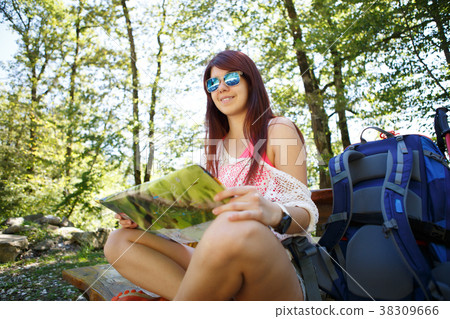Photo of tourist girl with map Photo of tourist girl with map 38309666