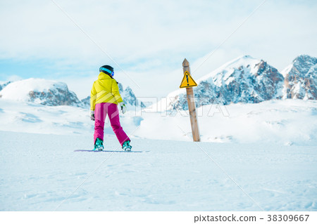 Picture of snowboarder woman wearing helmet at Picture of snowboarder woman wearing helmet at 38309667