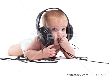 cute cheerful little boy with headphones cute cheerful little boy with headphones 38311533