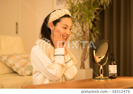 Young Japanese woman doing skin care at night 38312478