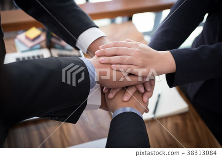 businessman joining hand, business team touching hands together - unity, harmony, teamwork, partnership, collaboration, corporate concept. businessman joining hand, business team touching hands together - unity, harmony, teamwork, partnership, collaboration, corporate concept. 38313084