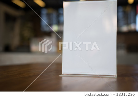 white label in cafe. display stand for acrylic tent card in coffee shop. mockup menu frame on table in bar restaurant. white label in cafe. display stand for acrylic tent card in coffee shop. mockup menu frame on table in bar restaurant. 38313250