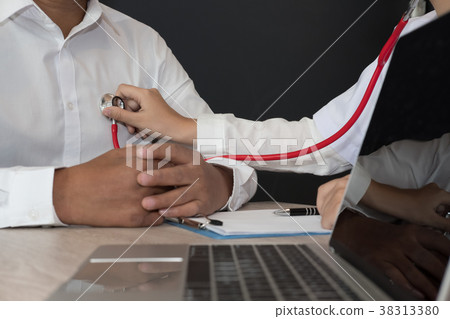doctor use stethoscope to examine pulse rate on patient chest at hospital. physician measure heartbeat. health care check up doctor use stethoscope to examine pulse rate on patient chest at hospital. physician measure heartbeat. health care check up 38313380