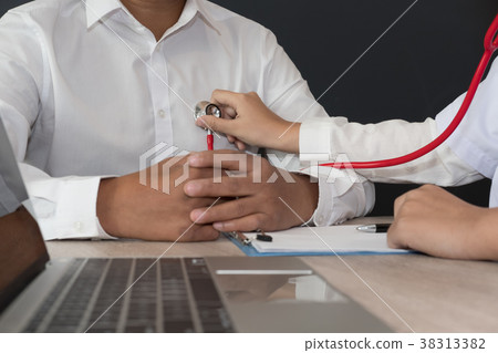 doctor use stethoscope to examine pulse rate on patient chest at hospital. physician measure heartbeat. health care check up doctor use stethoscope to examine pulse rate on patient chest at hospital. physician measure heartbeat. health care check up 38313382