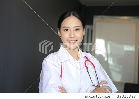 Confident smiling young female doctor posing with arms crossed. Portrait of medical staff, physician or practitioner on white background Confident smiling young female doctor posing with arms crossed. Portrait of medical staff, physician or practitioner on white background 38313388