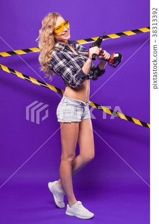 Sexy young builder girl in chechered shirt Sexy young builder girl in chechered shirt 38313392