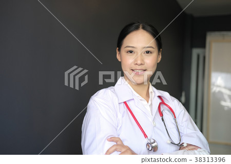 Confident smiling young female doctor posing with arms crossed. Portrait of medical staff, physician or practitioner on white background Confident smiling young female doctor posing with arms crossed. Portrait of medical staff, physician or practitioner on white background 38313396