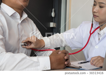 doctor use stethoscope to examine pulse rate on patient chest at hospital. physician measure heartbeat. health care check up doctor use stethoscope to examine pulse rate on patient chest at hospital. physician measure heartbeat. health care check up 38313416