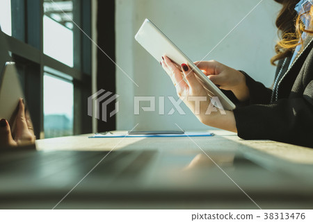 businesswoman using tablet computer at workplace. startup woman working with computer at office. young female entrepreneur analyze accounting market data. businesswoman using tablet computer at workplace. startup woman working with computer at office. young female entrepreneur analyze accounting market data. 38313476