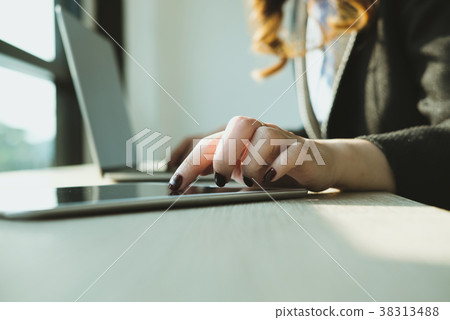 businesswoman using tablet computer at workplace. startup woman working with computer at office. young female entrepreneur analyze accounting market data. businesswoman using tablet computer at workplace. startup woman working with computer at office. young female entrepreneur analyze accounting market data. 38313488