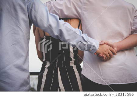 homosexual man hug woman while holding hands with secret lover. gay couple in love triangle. boyfriend cheating on girlfriend. same sex, homosexuality concept 38313596