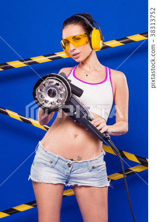 Beautiful sexy builder girl in white top, denim Beautiful sexy builder girl in white top, denim 38313752