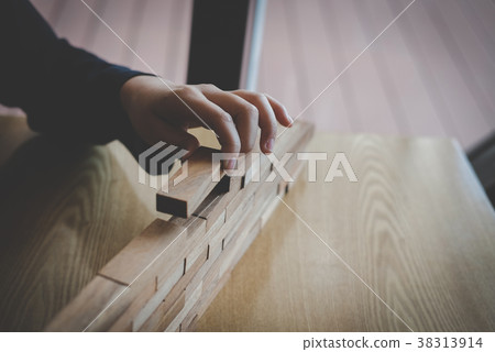 hand stacking wood block. growth, success & development in business 38313914