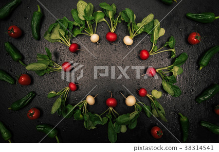 Fresh radish frame on black background. 38314541
