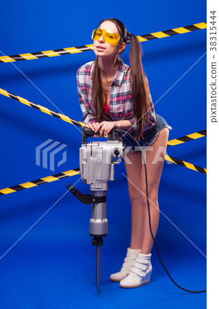 Sexy young builder girl in chechered shirt, denim 38315444