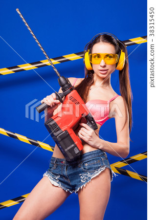 Attractive sexy builder girl in pink bikini, denim 38315450