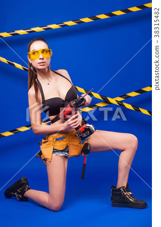 Attractive sexy builder girl in black bikini Attractive sexy builder girl in black bikini 38315482