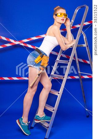 Young, pretty builder girl in white shirt, builder 38315522