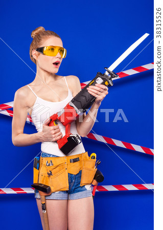 Young, pretty builder girl in white shirt, builder 38315526