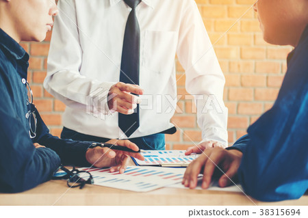 Businessteam discussing in creative meeting Businessteam discussing in creative meeting 38315694