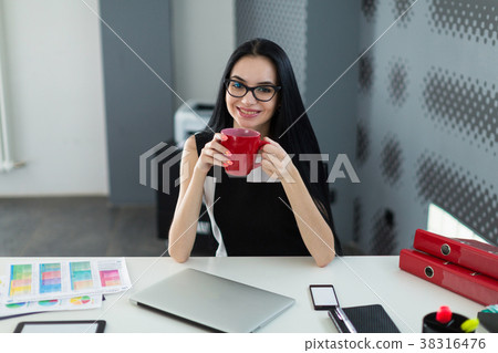 Pretty, young businesslady in black dress and Pretty, young businesslady in black dress and 38316476