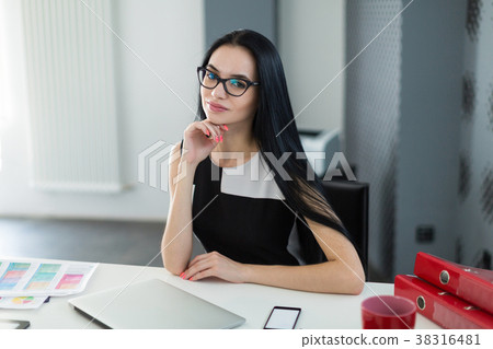 Pretty, young businesslady in black dress and 38316481