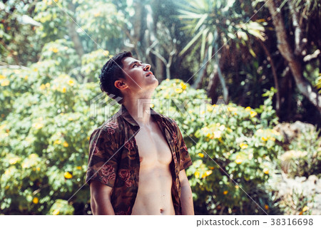 Happy handsome man enjoy vacation in jungle 38316698