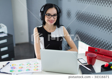 Beautiful young businesswoman in black dress 38316871