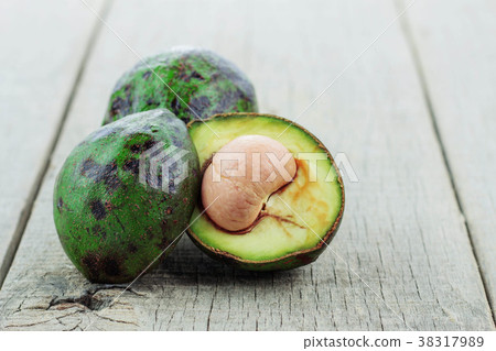 Avocado cut on wooden. 38317989