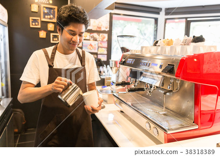 Barista made drink by coffee machine. 38318389